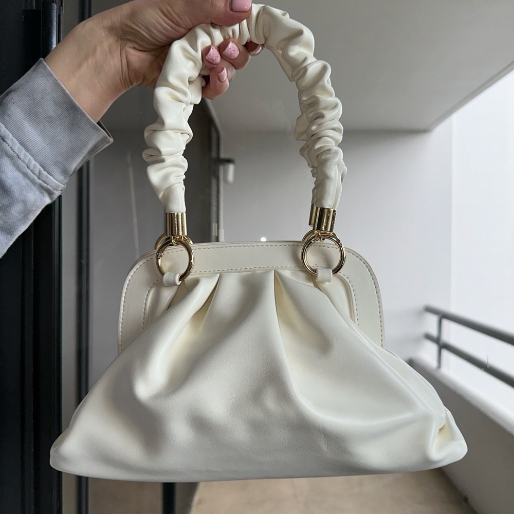 Ego x Molly Mae handheld mini bag with ruched handle in white from ASOS.